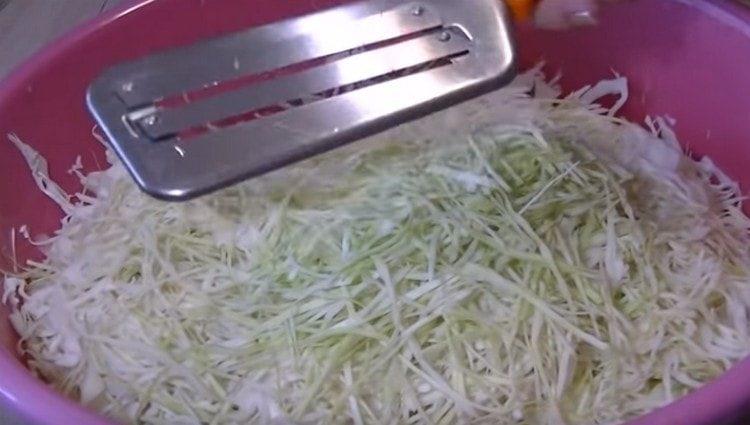 Shred the cabbage.