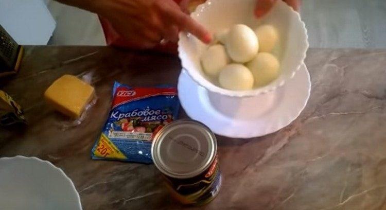 Hard-boiled eggs and peel.