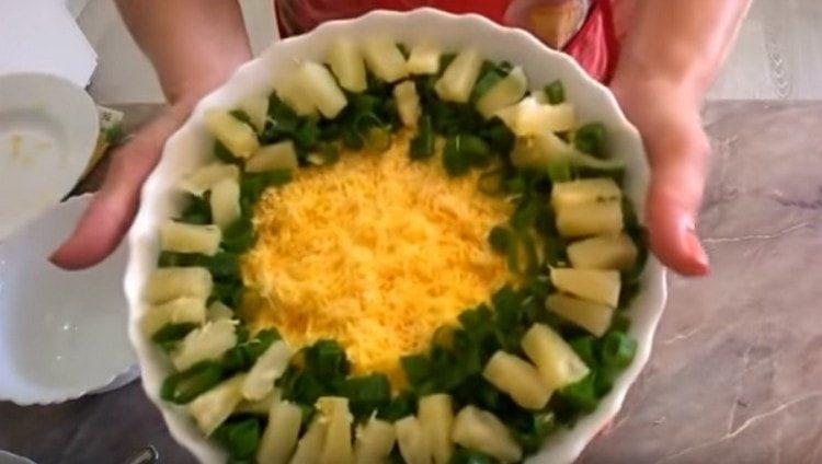 Decorate salad with crab sticks and pineapple with fresh herbs.