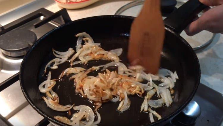 Fry the chopped onion in a pan until golden brown.