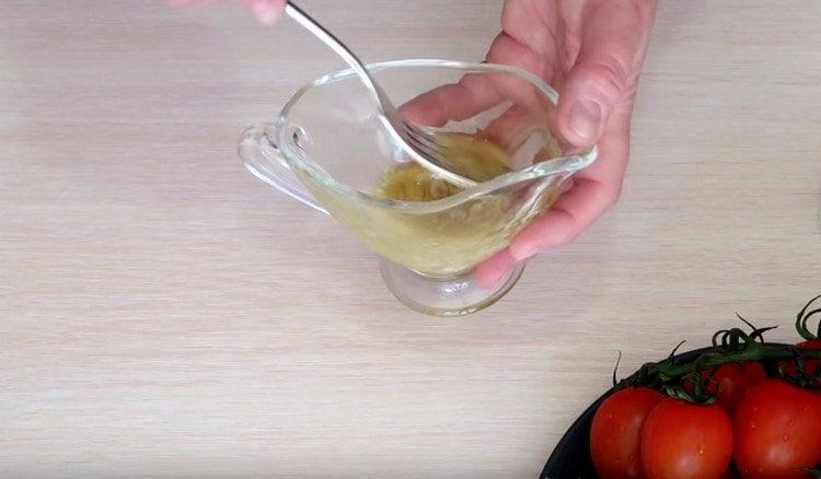 Beat vegetable oil with a fork, adding mustard to it