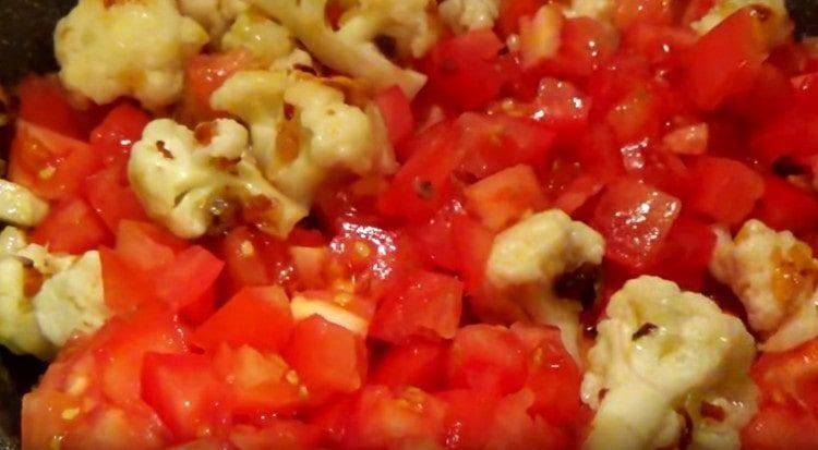 Add tomatoes, mix.