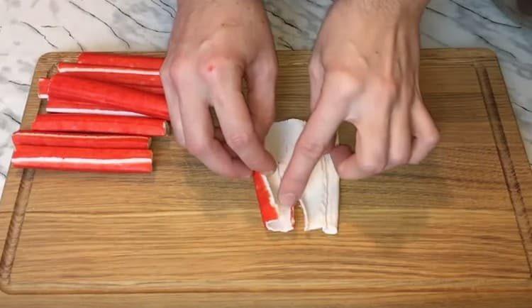 We carefully twist the crab sticks.