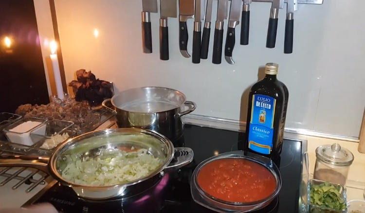 Fry onions and celery in a pan.