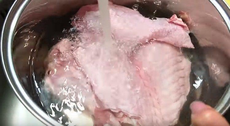 Turkey wings are cut into joints and filled with water.