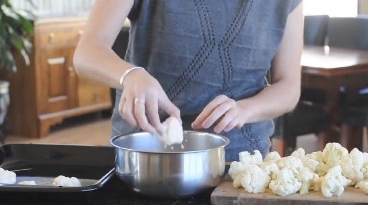 dip each slice of cabbage in batter and spread on a baking sheet.