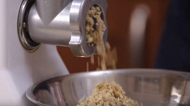 Pass walnuts through a meat grinder.