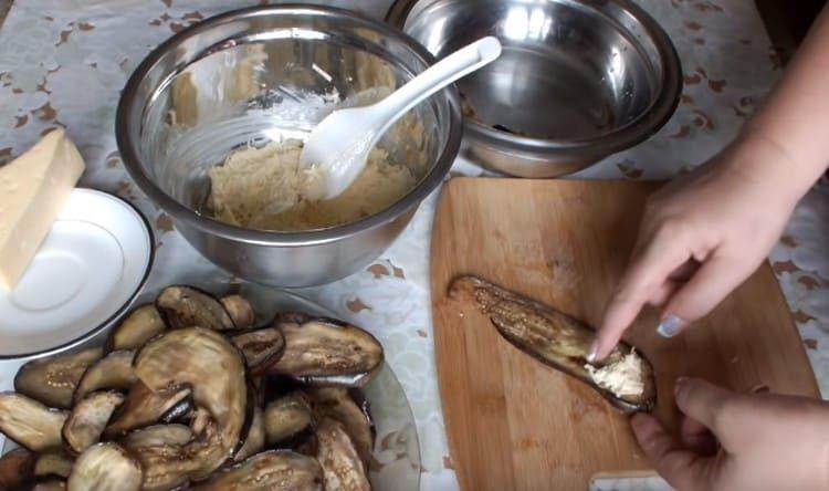 put cheese filling on each piece of eggplant, roll it up with a roll.