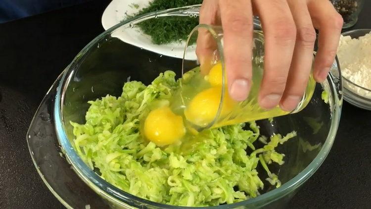 To cook, add eggs to the zucchini
