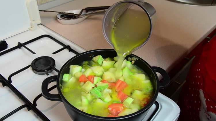 pour the broth into the vegetables