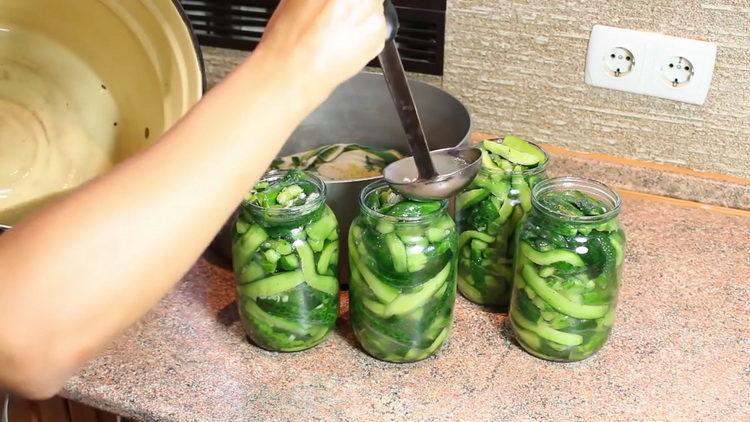 Cucumbers with garlic for the winter according to a step by step recipe with a photo