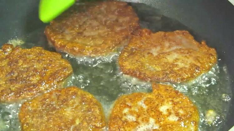 fry chicken liver patties in a pan