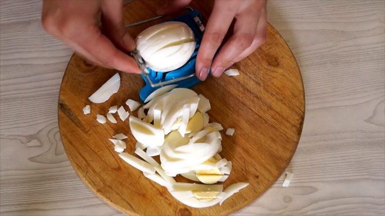 Cut eggs to make a salad