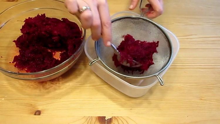 Cooking beetroot salad with carrots and cheese