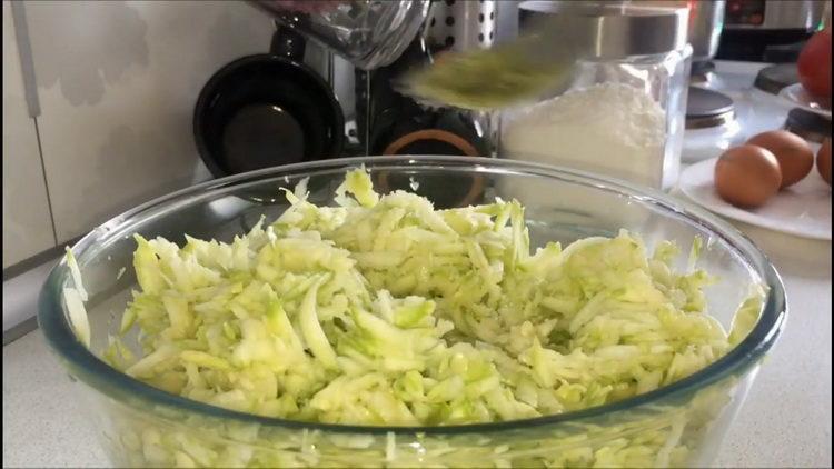 Cooking a cake of zucchini with tomatoes