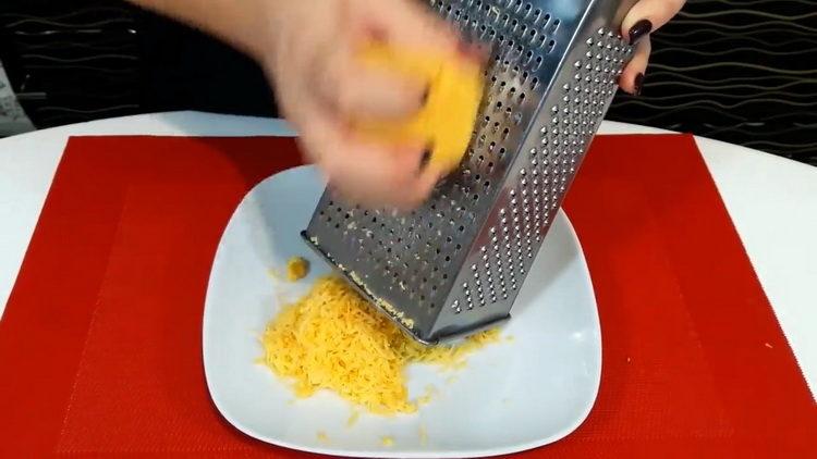 Grate cheese to cook