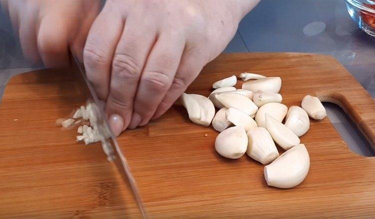 Grind the garlic.