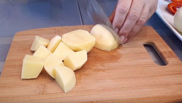 Chop the potatoes.