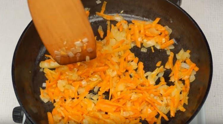 Add the grated carrots to the onion.