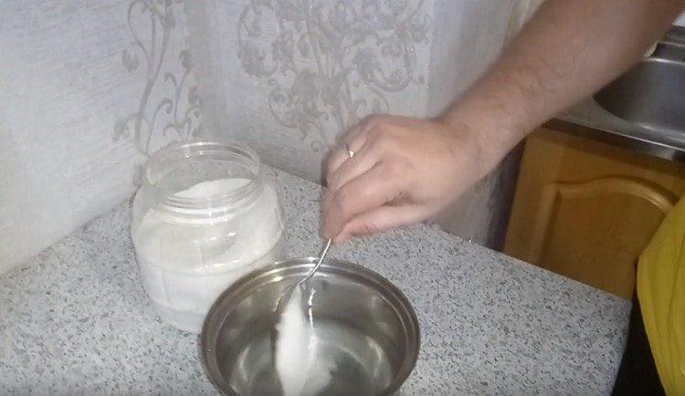 Dissolve sugar in water.