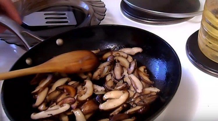 then add mushrooms to the pan, fry.
