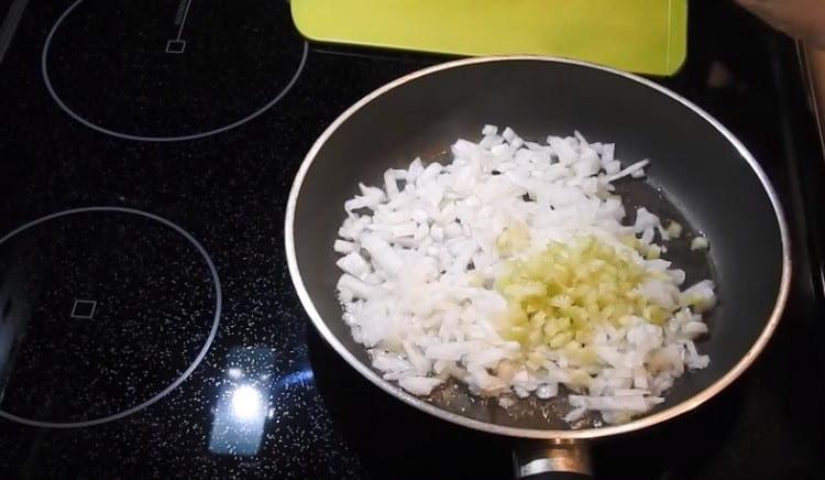 Fry onions and celery in a pan.