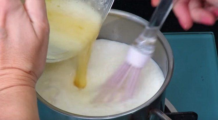 Pour the egg-milk mixture into the remaining milk.