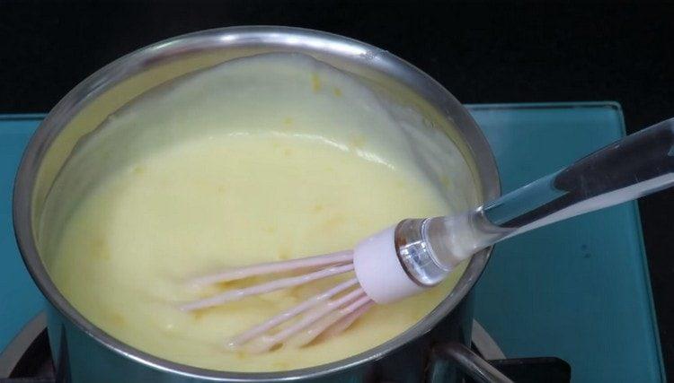 Stirring, cook the cream until thickened.