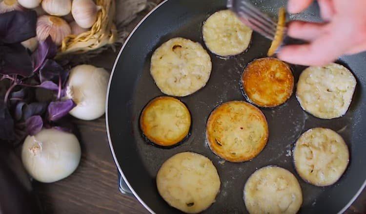 Fry the eggplant in a pan until golden brown.