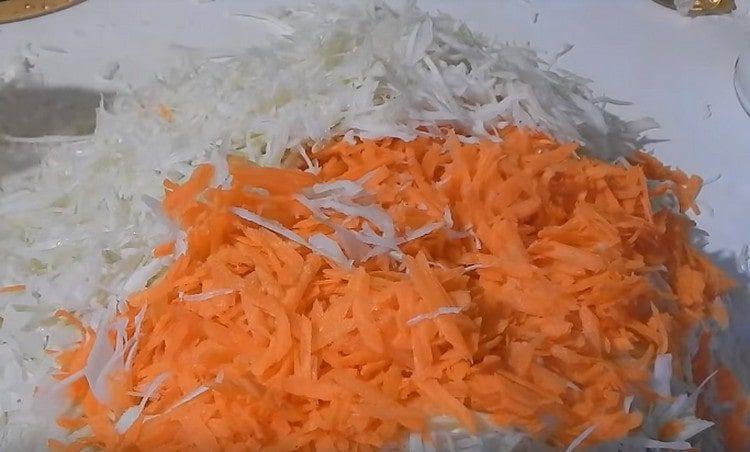 Grate the carrots and add to the cabbage.