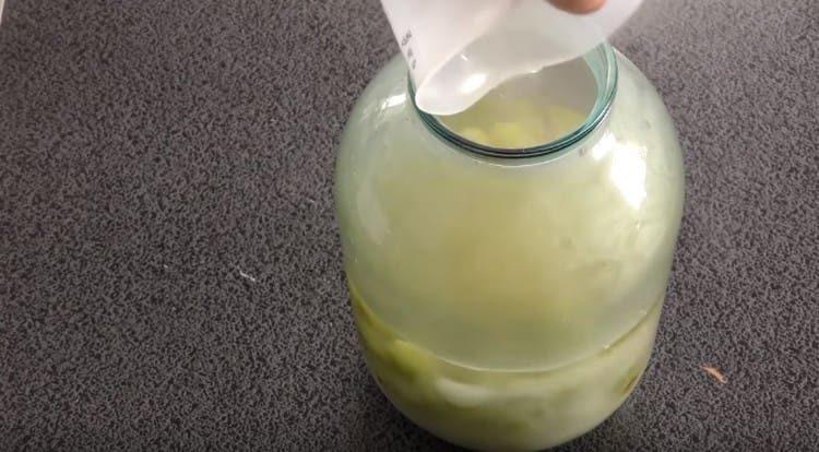 Pour boiling water into a jar.