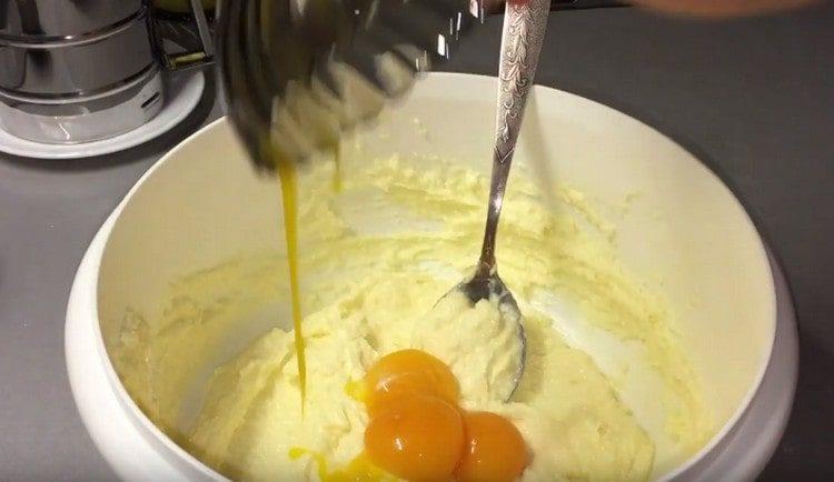 Yolks are added to the oil mass.
