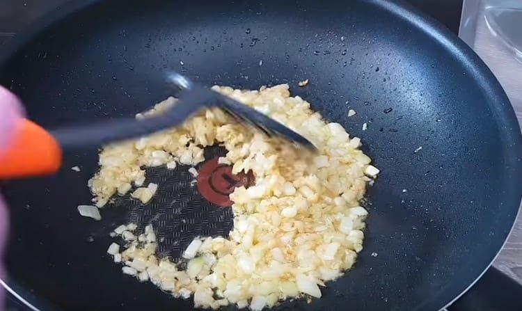 Add chopped garlic to the onion and fry them until golden.