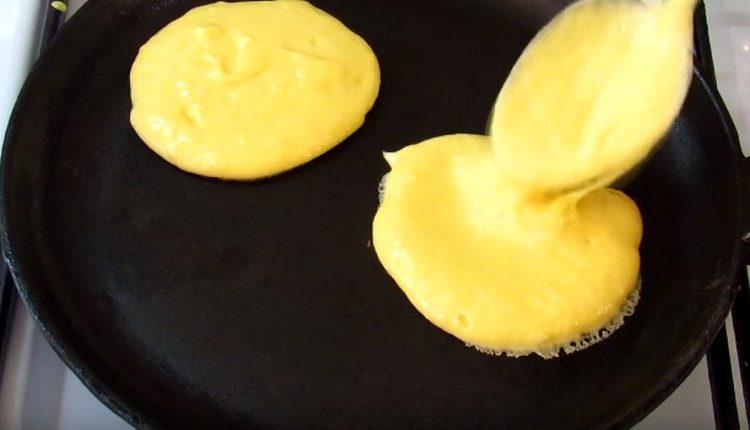Pour the dough into a preheated pan.