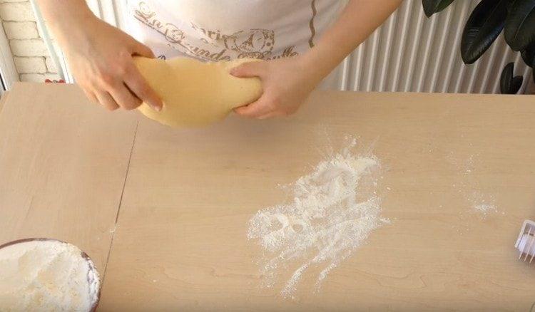 Then knead the dough on the work surface.