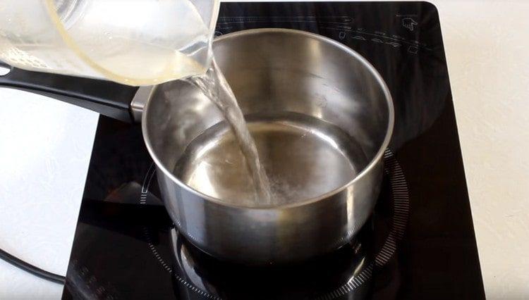 Pour water into the pan, bring to a boil.