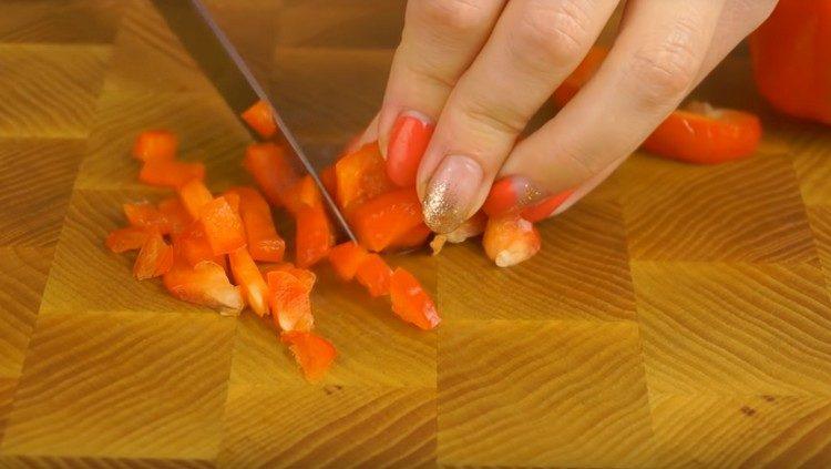 Finely chop the red bell pepper.