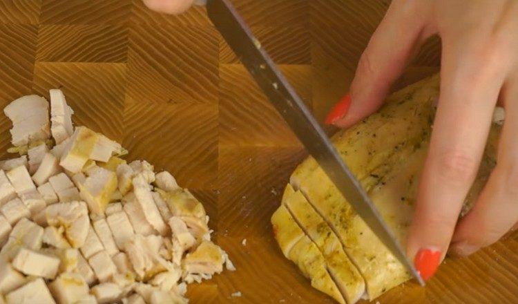 Cut the baked chicken breast.