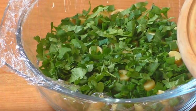 Pour the chopped greens on top of the mushrooms.