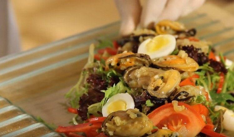 We lay quail eggs cut in half on top of the salad.