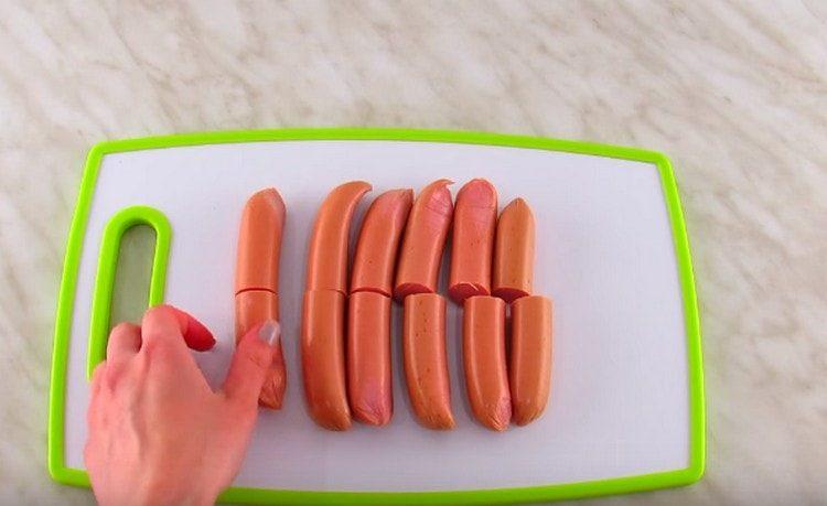 Sausages cut in half.