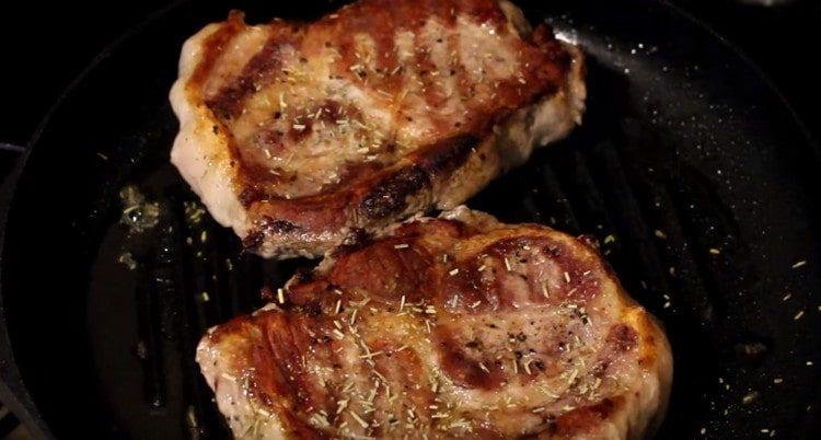 Sprinkle steaks with rosemary.