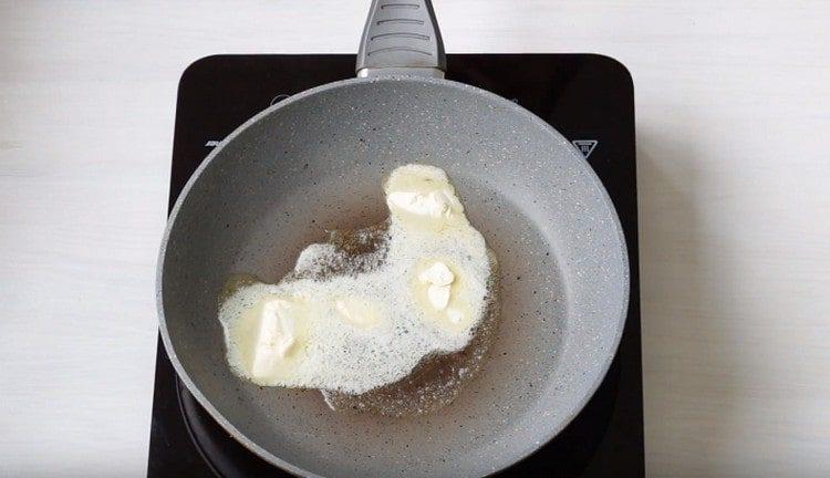 We heat the pan with a piece of butter.