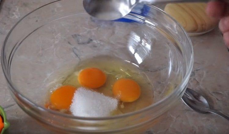 Add sugar to the eggs.