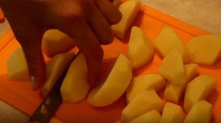 chop coarsely peeled potatoes.