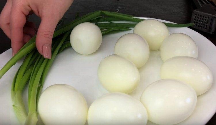 Hard-boiled eggs and peel.