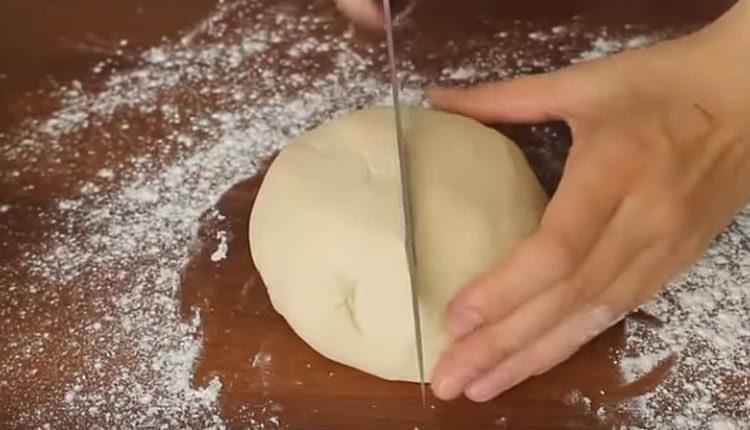 Knead the dough a bit and divide in half.