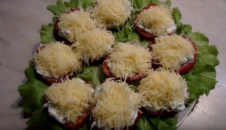 Sprinkle tomatoes with grated cheese.