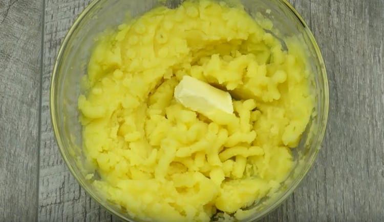 Add butter to mashed potatoes.