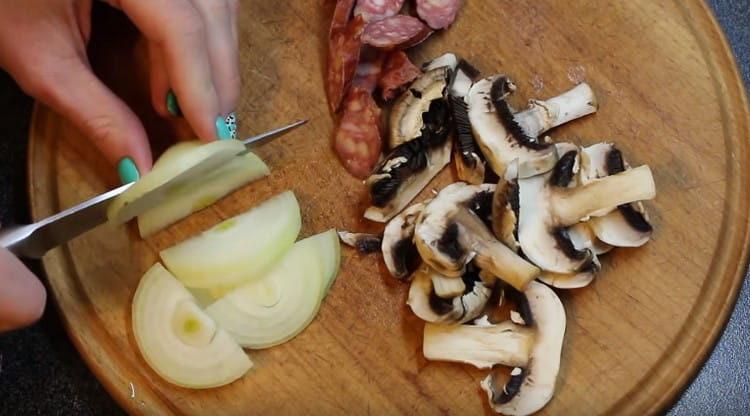 We chop hunting sausages, mushrooms and onions